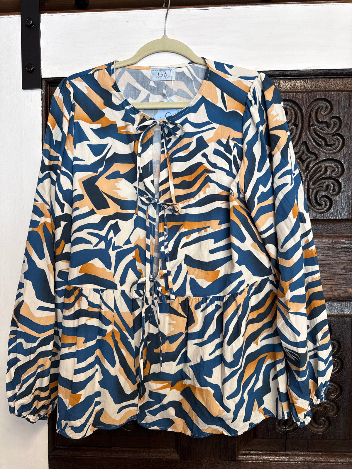 Abstract Navy Orange and Cream peplum blouse